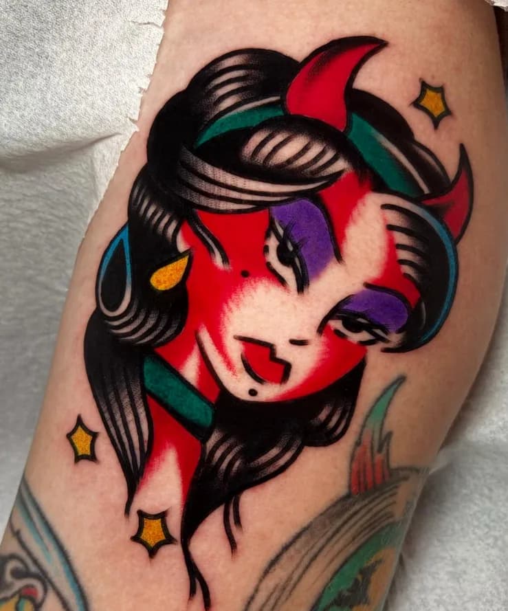 Traditional colorful she-devil portrait tattoo with horns and stars, on the arm